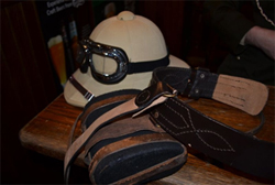 A hat with goggles, a canteen and belt from Kevin's costume